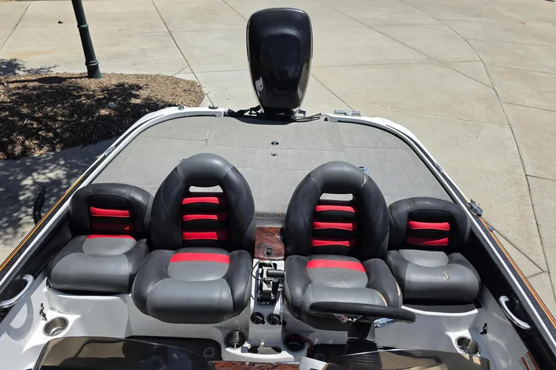 Slide: The Image of 2008 Nitro Z-9 boat interior with black and red seating, steering wheel, and motor. - 1