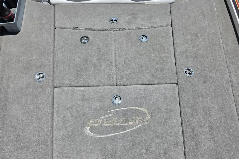 Slide: The Image of 2008 Nitro Z-9 boat deck with carpet and storage compartments. - 8