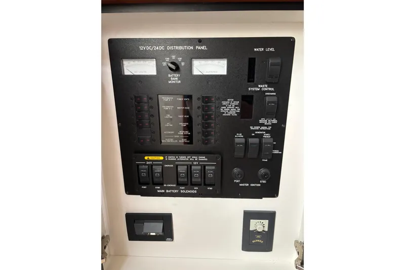 Slide: The Image of Electrical distribution panel on a 2003 Sea Ray 550 Sundancer yacht. - 43