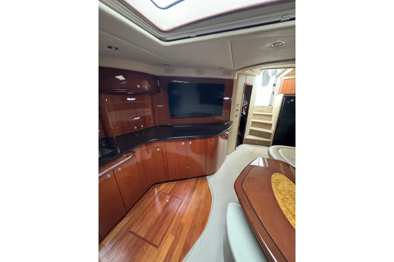 Slide: The Image of Luxurious interior of 2003 Sea Ray 550 Sundancer yacht with wood finishes and modern amenities. - 19