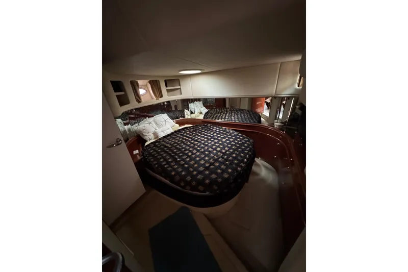 Slide: The Image of Luxurious cabin interior of 2003 Sea Ray 550 Sundancer yacht with elegant bedding. - 24