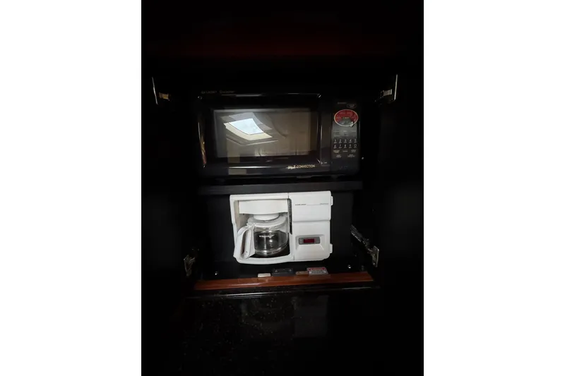 Slide: The Image of Microwave and coffee maker in 2003 Sea Ray 550 Sundancer yacht kitchen. - 39