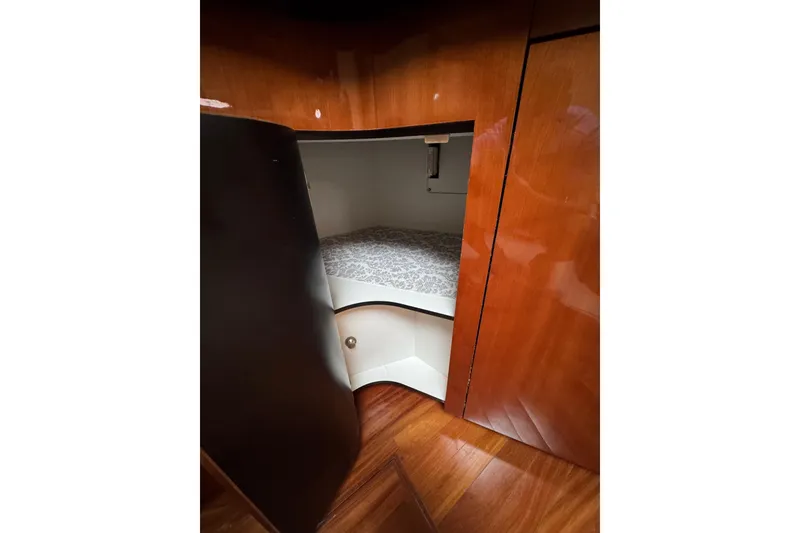 Slide: The Image of Open cabinet with patterned interior on 2003 Sea Ray 550 Sundancer yacht. - 25
