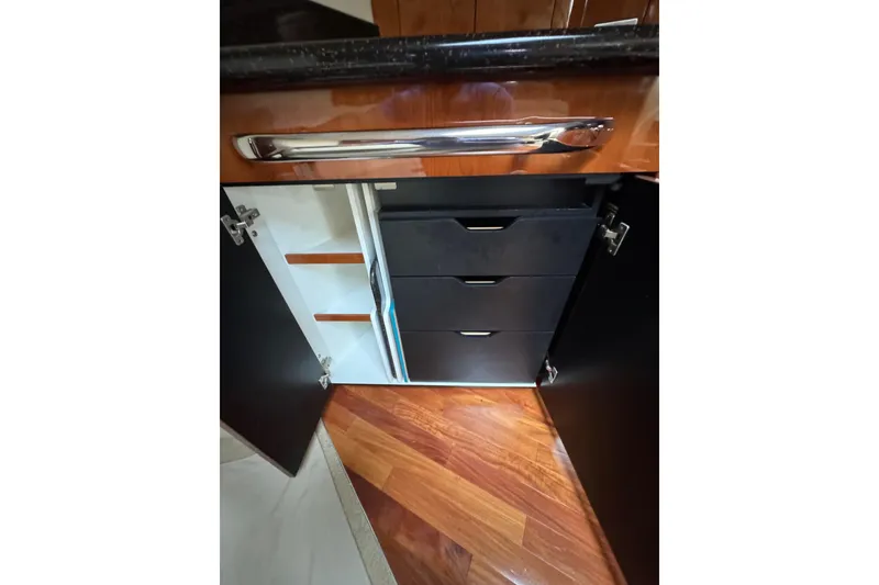 Slide: The Image of Open cabinet with drawers in 2003 Sea Ray 550 Sundancer yacht interior. - 27