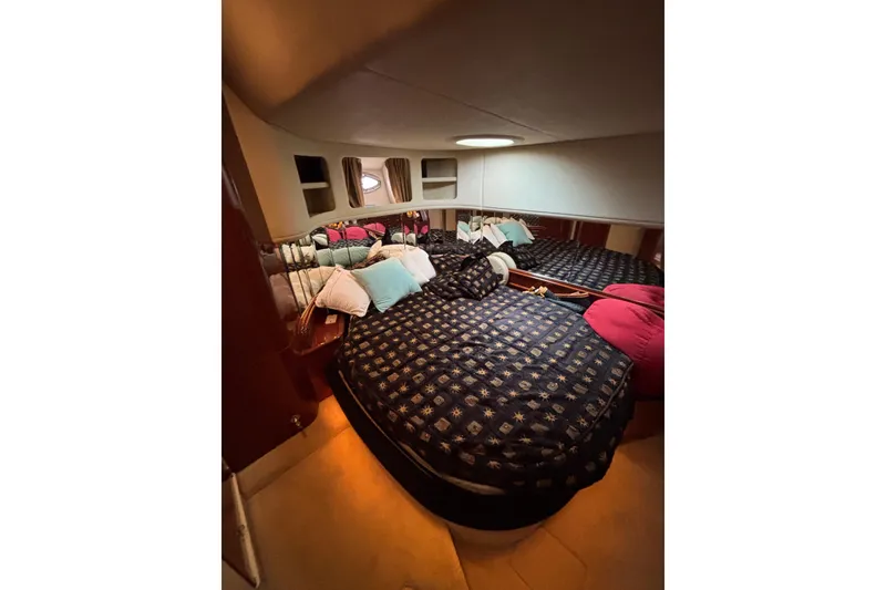 Slide: The Image of Luxurious cabin interior of 2003 Sea Ray 550 Sundancer yacht with cozy bedding. - 32