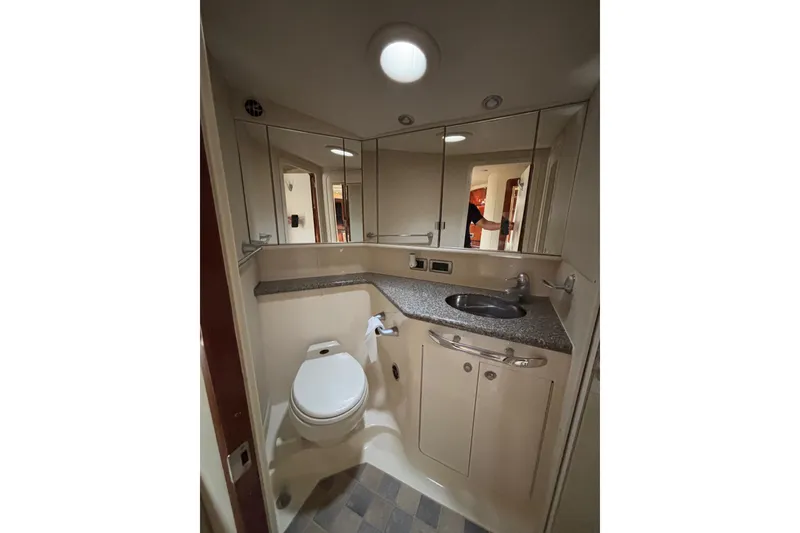 Slide: The Image of Luxurious bathroom in 2003 Sea Ray 550 Sundancer yacht with modern fixtures and ample storage. - 34