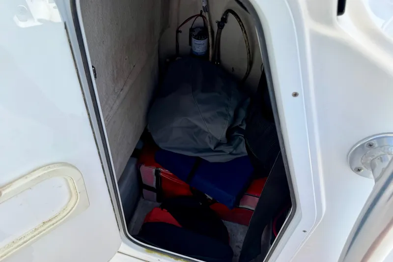 Slide: The Image of Storage compartment in a 2016 Sportsman Heritage 211 Center Console boat. - 13