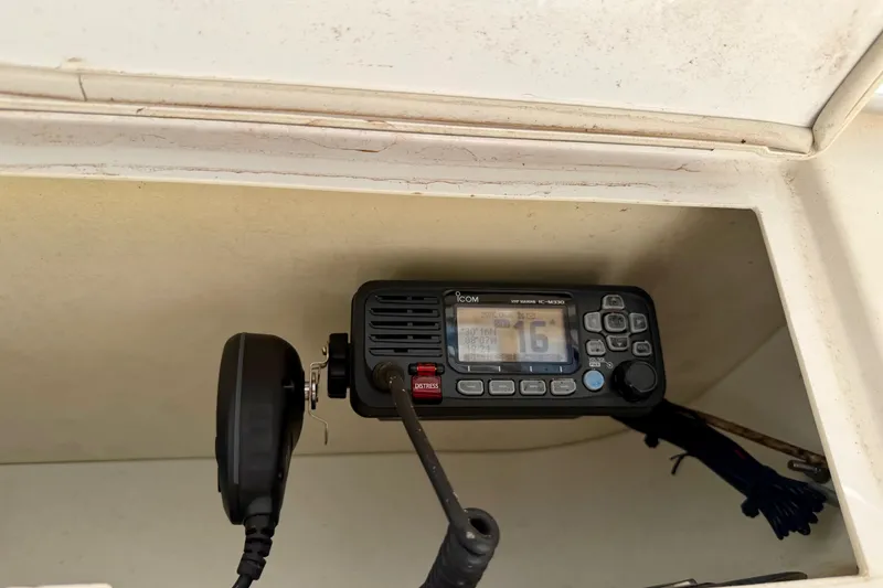 Slide: The Image of VHF marine radio installed on a 2016 Sportsman Heritage 211 Center Console boat. - 16