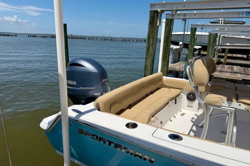 Slide: The Image of 2016 Sportsman Heritage 211 Center Console boat docked with Yamaha 150 engine. - 4