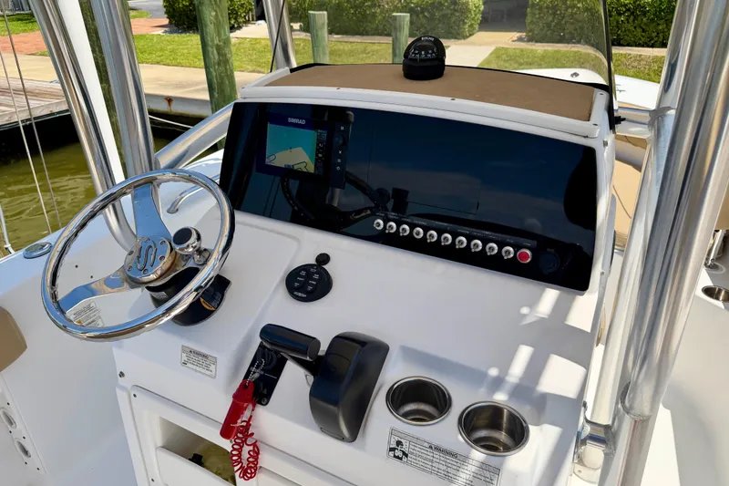 Slide: The Image of Center console of 2016 Sportsman Heritage 211 boat with steering wheel and navigation system. - 8