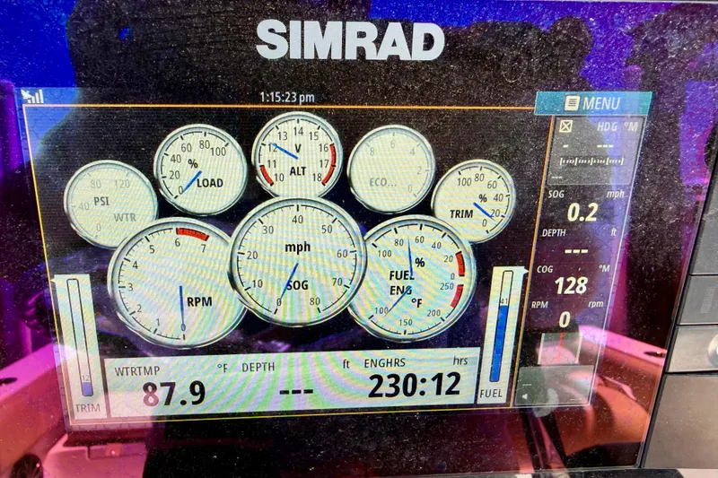 Slide: The Image of Simrad marine display showing gauges and data on a 2016 Sportsman Heritage 211 Center Console. - 9