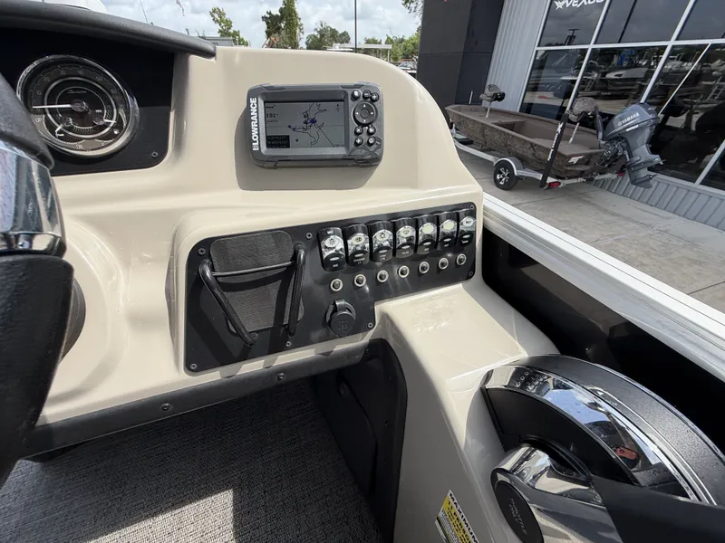 Slide: The Image of The image shows the dashboard of a 2024 Barletta A20UC boat with a navigation system. - 22
