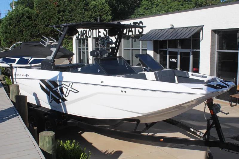 The Image of 2024 ATX Surf Boats 22 Type-S displayed at dealership, sleek design, white exterior. - 1