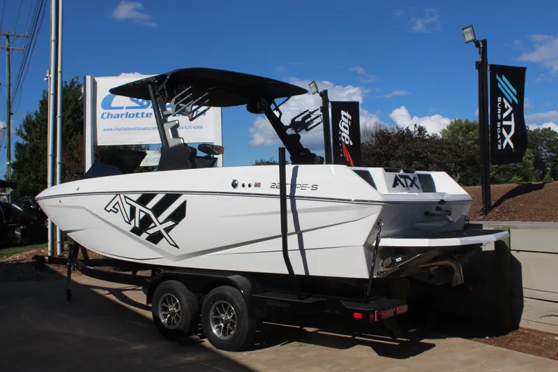Slide: The Image of 2024 ATX Surf Boats 22 Type-S on trailer, displayed outdoors under clear sky. - 4