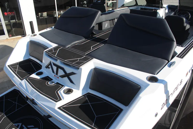 Slide: The Image of 2024 ATX Surf Boats 22 Type-S with sleek black seating and modern design. - 7