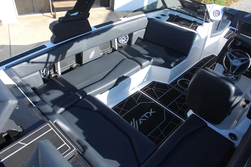 Slide: The Image of 2024 ATX Surf Boats 22 Type-S interior with sleek black seating and modern design. - 8