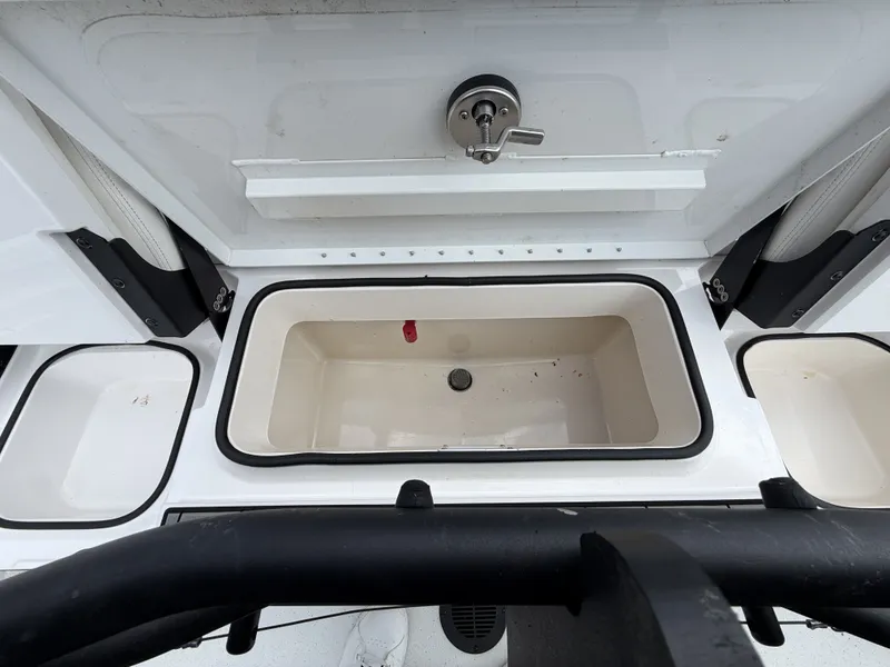 Slide: The Image of An open storage compartment on a 2022 Vexus AVX1980CC boat. - 16