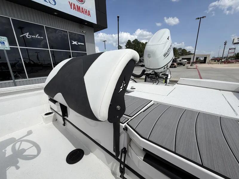 Slide: The Image of The image shows the stern of a Vexus AVX1980CC boat with a Suzuki outboard motor. - 19