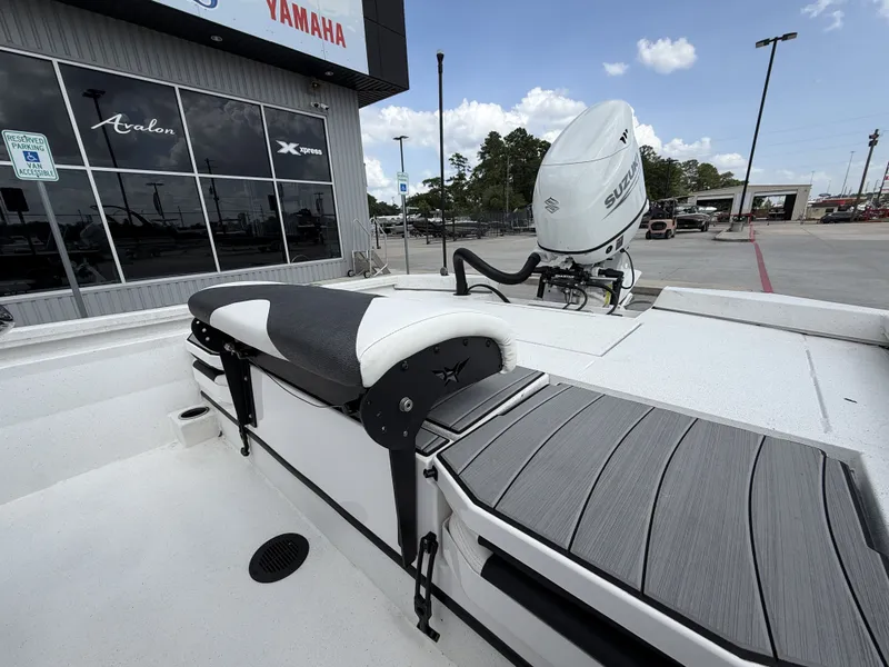 Slide: The Image of The image shows the stern of a Vexus AVX1980CC boat with a Suzuki outboard motor. - 20