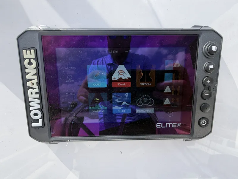 Slide: The Image of A Lowrance Elite 9 screen displaying various navigation and sonar options. - 22