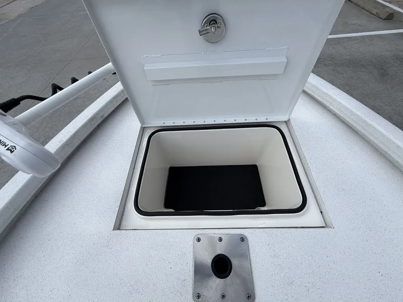 Slide: The Image of An open storage compartment on a 2022 Vexus AVX1980CC boat. - 34