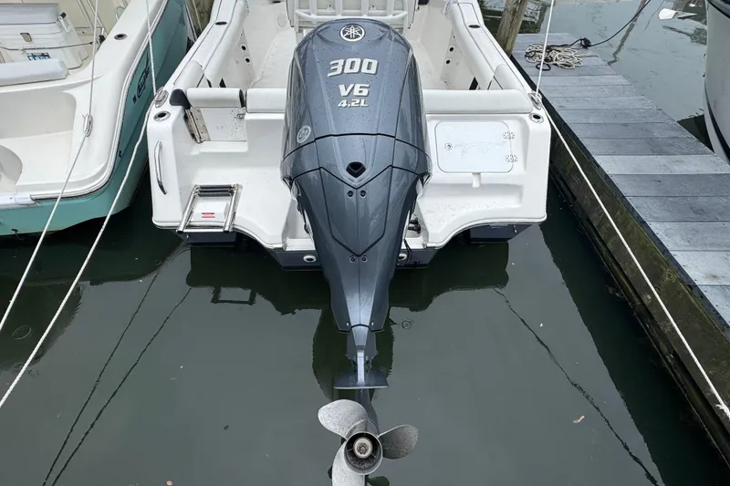 Slide: The Image of 2022 Tidewater 232 SS boat with Yamaha 300 V6 outboard motor at dock. - 22