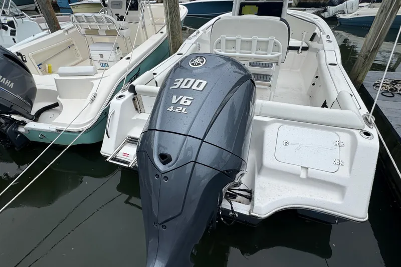 Slide: The Image of 2022 Tidewater 232 SS boat with Yamaha 300 V6 engine docked in marina. - 23