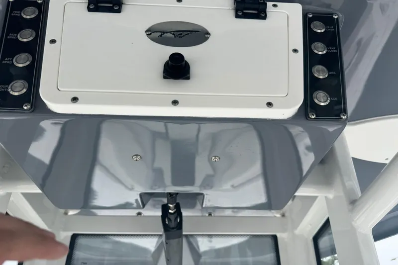 Slide: The Image of Control panel of a 2022 Tidewater 232 SS boat with various switches. - 24