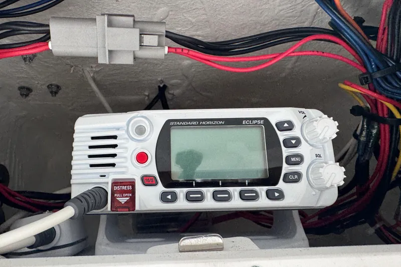 Slide: The Image of Standard Horizon Eclipse radio on 2022 Tidewater 232 SS boat, surrounded by colorful wiring. - 25