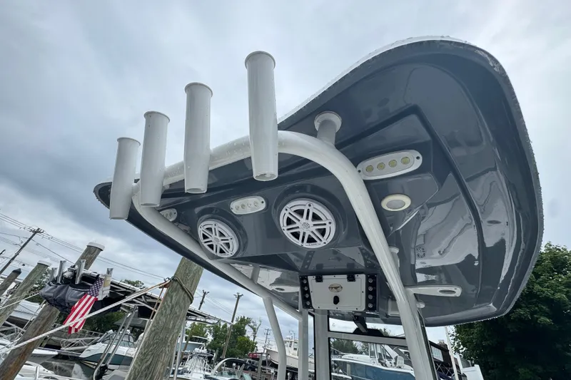 Slide: The Image of 2022 Tidewater 232 SS boat with rod holders and speakers on the T-top. - 4