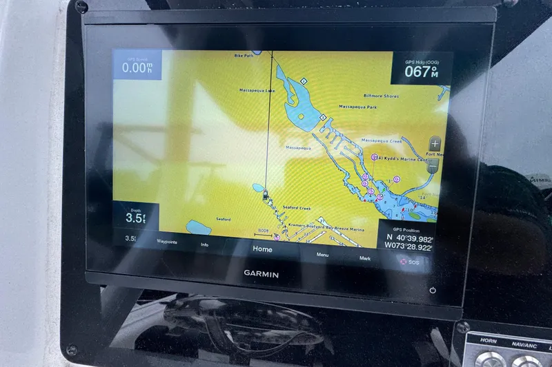 Slide: The Image of Garmin GPS display on 2022 Tidewater 232 SS boat showing navigation map. - 6