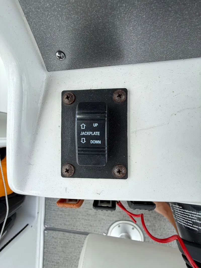 Slide: The Image of Close-up of a jackplate control switch on a boat. - 23