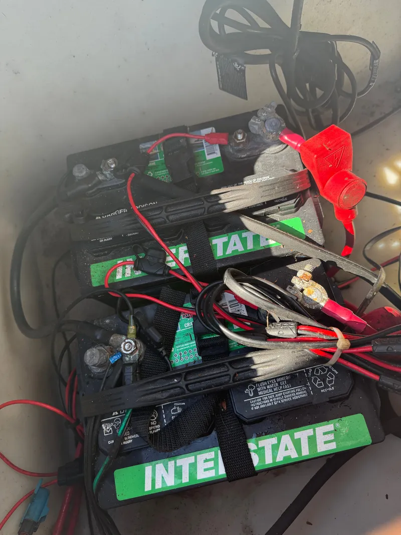 Slide: The Image of Batteries in a boat with cables and connectors. - 27