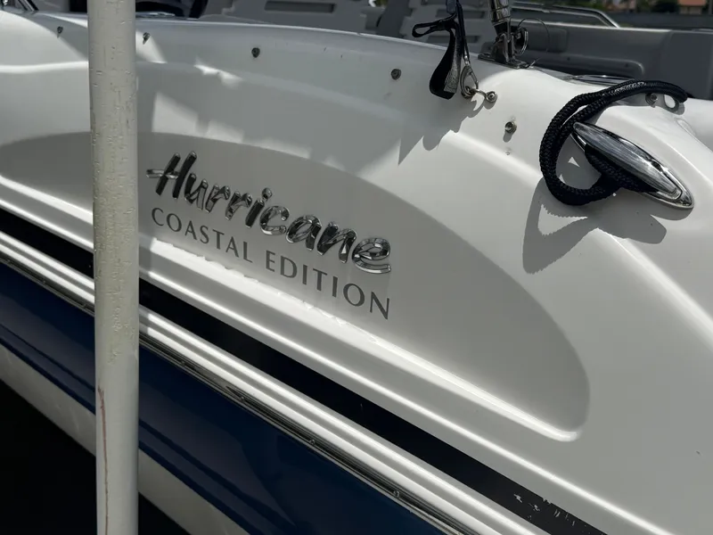 Slide: The Image of Close-up of the "Hurricane Coastal Edition" lettering on a white boat. - 3