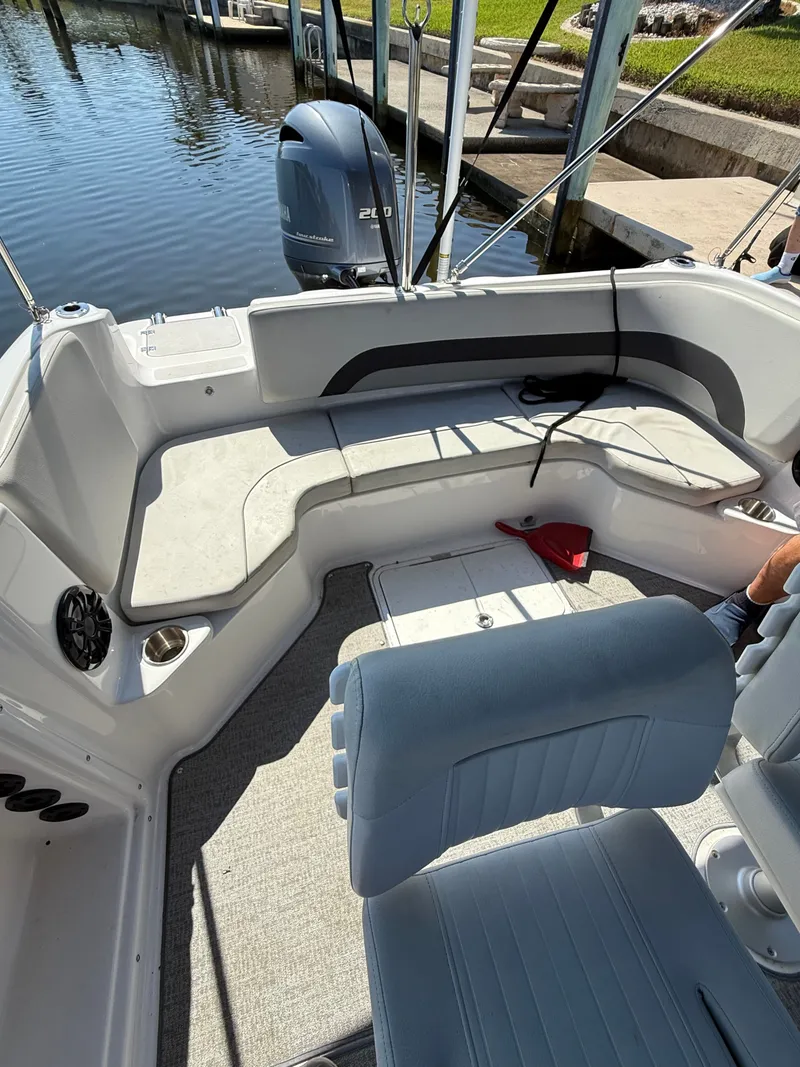 Slide: The Image of The image shows the cockpit of a 2022 Hurricane 231 SS boat with gray seating. - 5