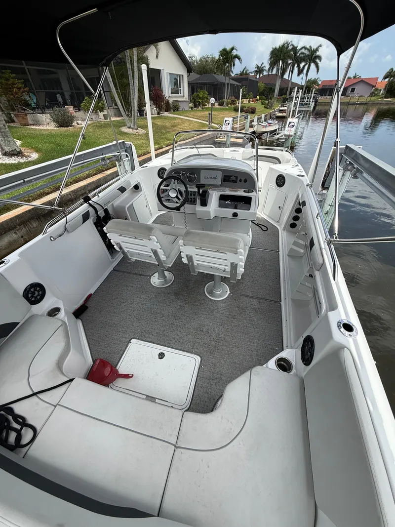 Slide: The Image of The image shows the cockpit of a 2022 Hurricane 231 SS boat with two seats and a steering wheel. - 7