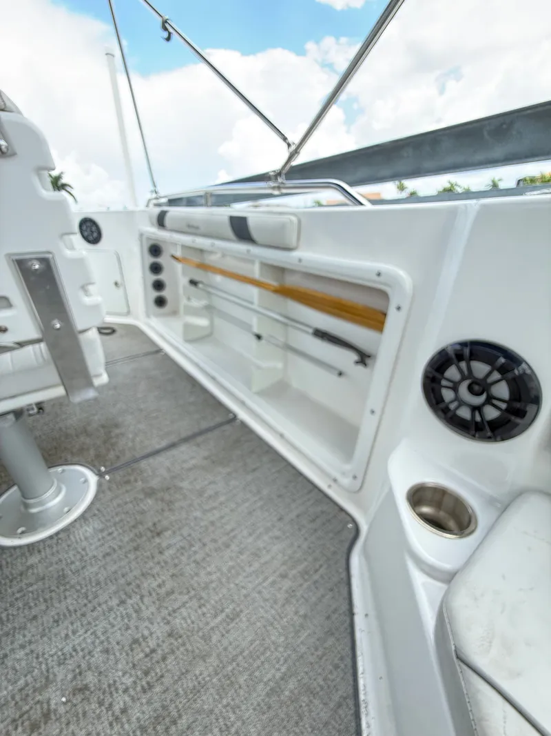 Slide: The Image of The image shows the cockpit of a 2022 Hurricane 231 SS boat with storage and speakers. - 9