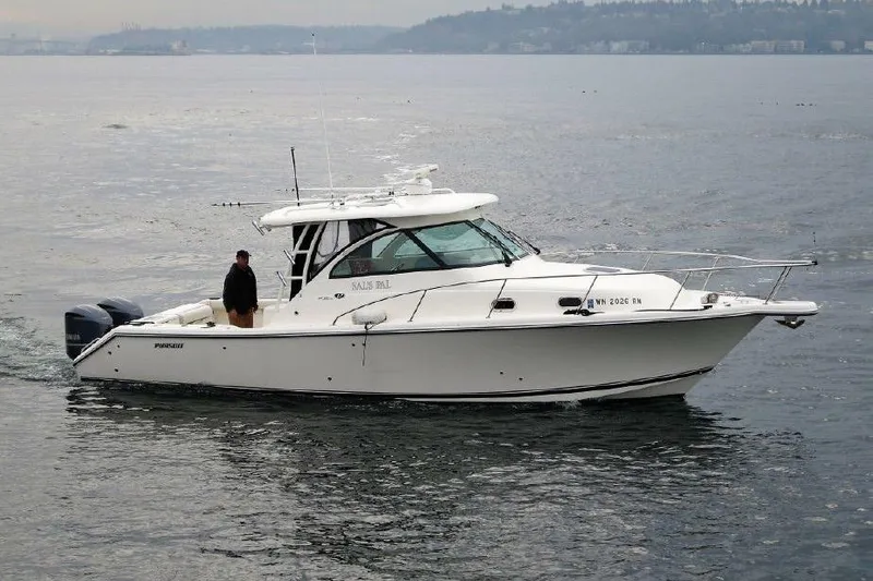 Slide: The Image of 2010 Pursuit OS 345 Offshore boat cruising on calm waters. - 3