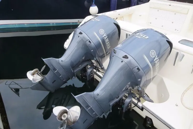Slide: The Image of Twin Yamaha outboard motors on a 2010 Pursuit OS 345 Offshore boat. - 6