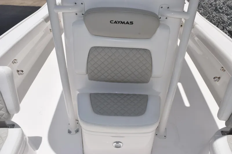 Slide: The Image of Caymas 26 HB 2022 boat seat with quilted cushions and sleek white design. - 12