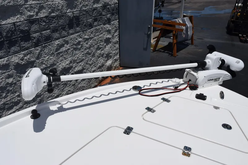 Slide: The Image of 2022 Caymas 26 HB boat with Minn Kota trolling motor on deck. - 14