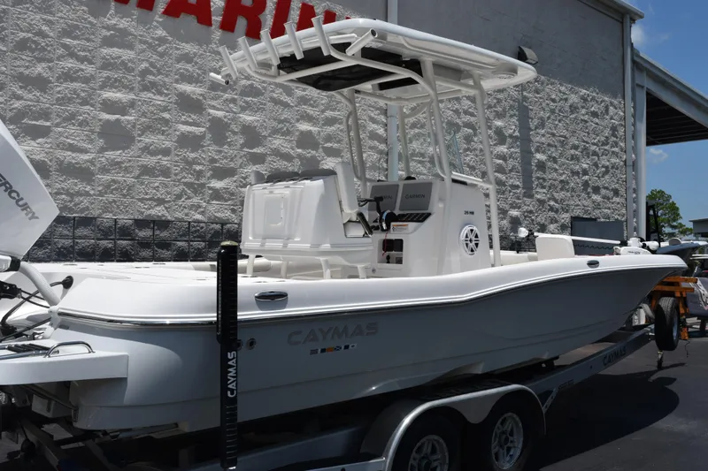 Slide: The Image of 2022 Caymas 26 HB boat on trailer, featuring sleek design and modern equipment. - 4