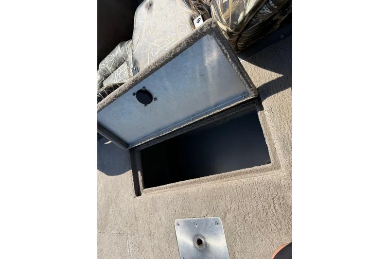 Slide: The Image of Open storage compartment on 2010 SeaArk Stealth 190 boat. - 26