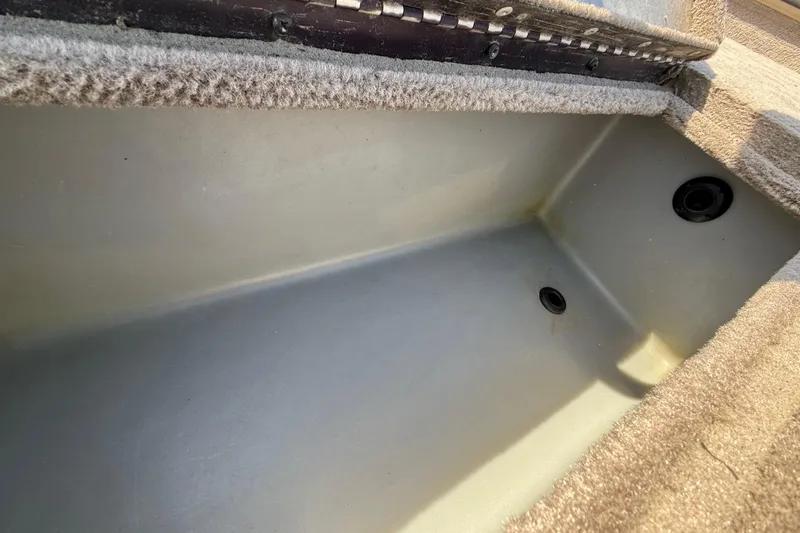 Slide: The Image of Interior view of a 2010 SeaArk Stealth 190 boat compartment. - 31