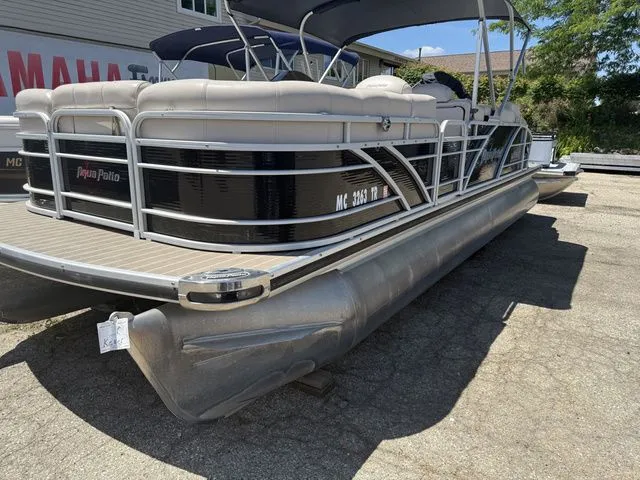 Slide: The Image of A 2014 Godfrey AP 240 pontoon boat is on a dry dock. - 2