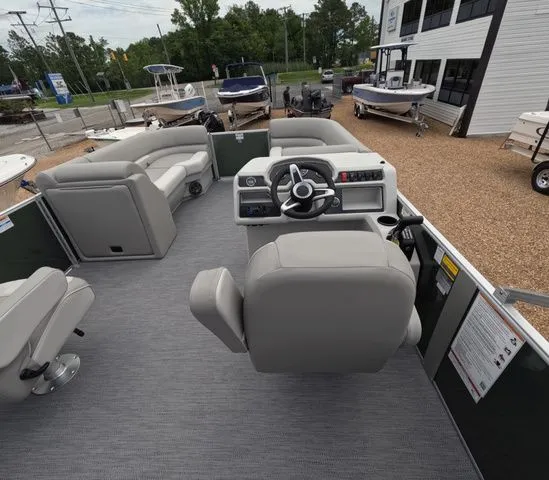 Slide: The Image of Interior of a Godfrey Xperience Lounge 2286 SBX pontoon boat with gray seating and helm console. - 12