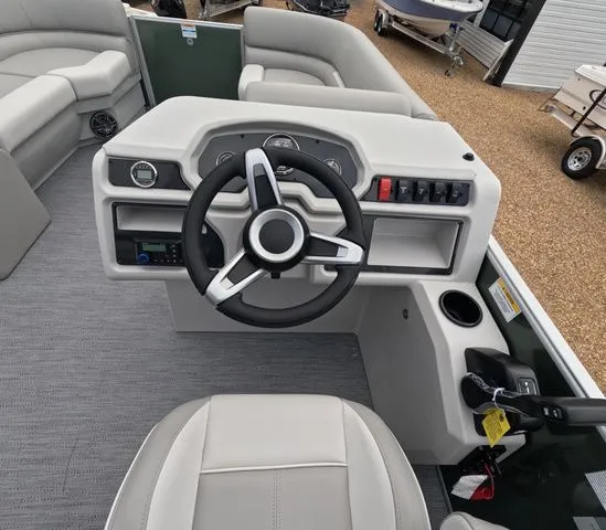 Slide: The Image of Helm of a 2027 Godfrey Xperience Lounge 2286 SBX with steering wheel and controls. - 16