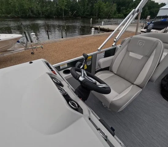 Slide: The Image of The image shows the cockpit of a 2027 Godfrey Xperience Lounge 2286 SBX with a comfortable seat. - 17