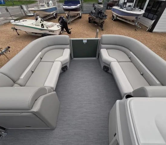 Slide: The Image of The image shows the interior of a 2027 Godfrey Xperience Lounge 2286 SBX with gray seating. - 19