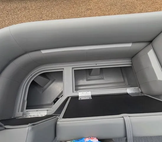 Slide: The Image of Gray upholstery and storage compartment on a boat. - 21